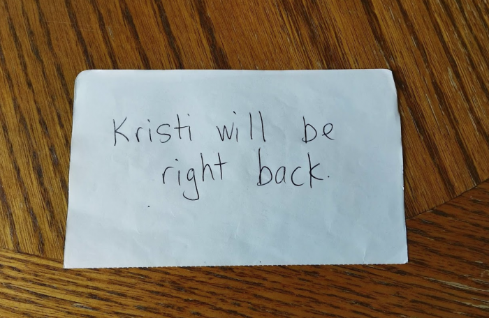 a photo of a note that says "Kristi will be right back"